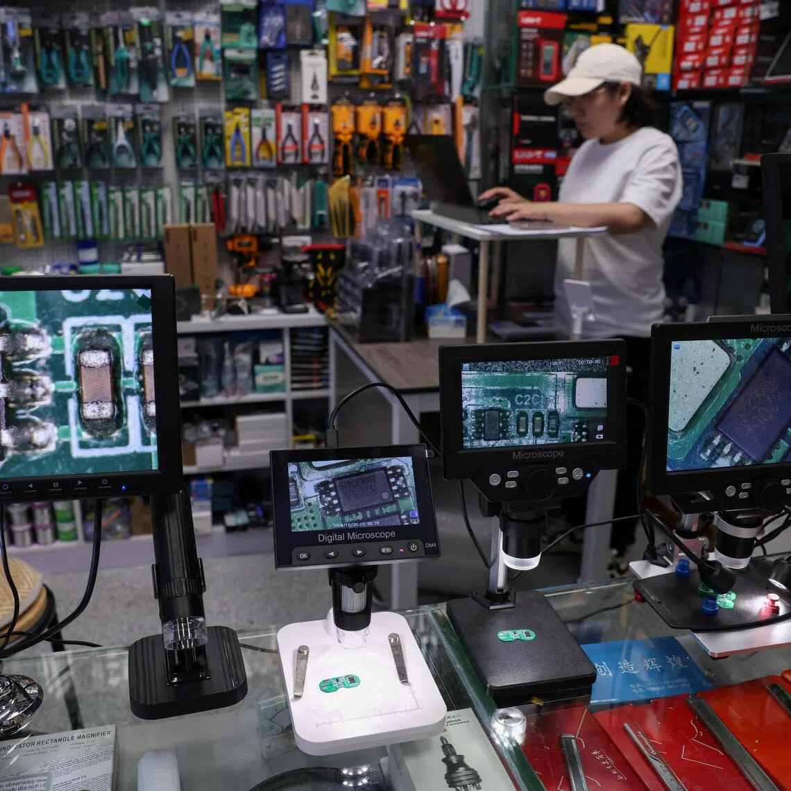 Chips at a booth in a mall in Shenzhen. The crunch is unfolding as investors question whether the billions of dollars poured into AI infrastructure have inflated a bubble.