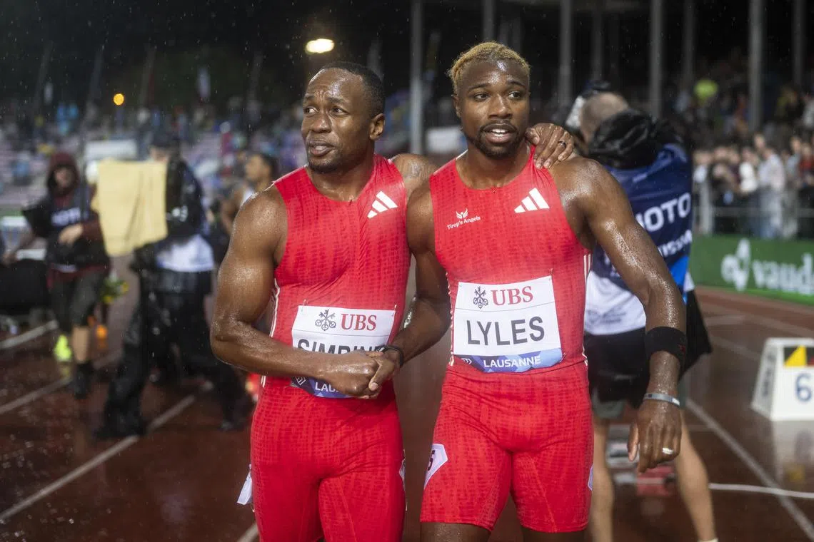 Jamaica's Oblique Seville (left) and Noah Lyles of the US shaking hands after the 100m in Lausanne, on Aug 20.