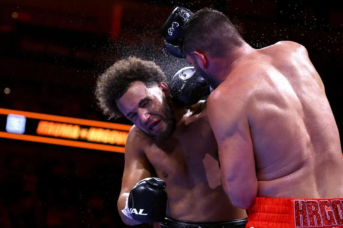 Britain’s Moses Itauma reeling from a punch by Croatia’s Filip Hrgovic in their IBF world heavyweight title bout at London’s O2 Arena on Aug 29.
