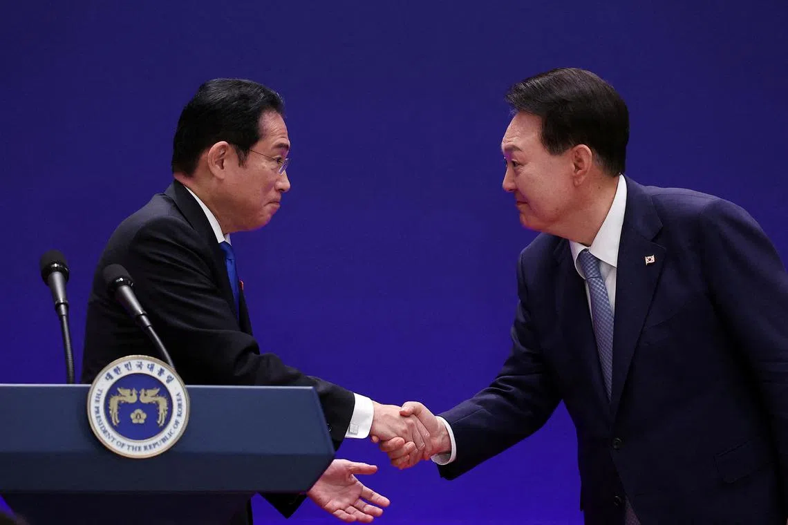 FILE PHOTO: South Korean President Yoon Suk Yeol shakes hands with Japanese Prime Minister Fumio Kishida during a joint press conference in Seoul, South Korea, May 27, 2024. REUTERS/Kim Hong-Ji/Pool/File Photo
