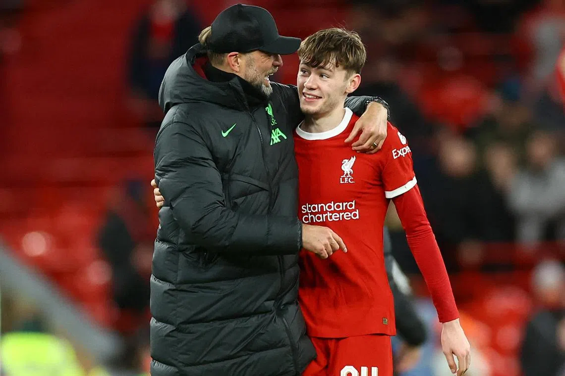 Liverpool manager Juergen Klopp and Conor Bradley celebrating after the League Cup match against Fulham.