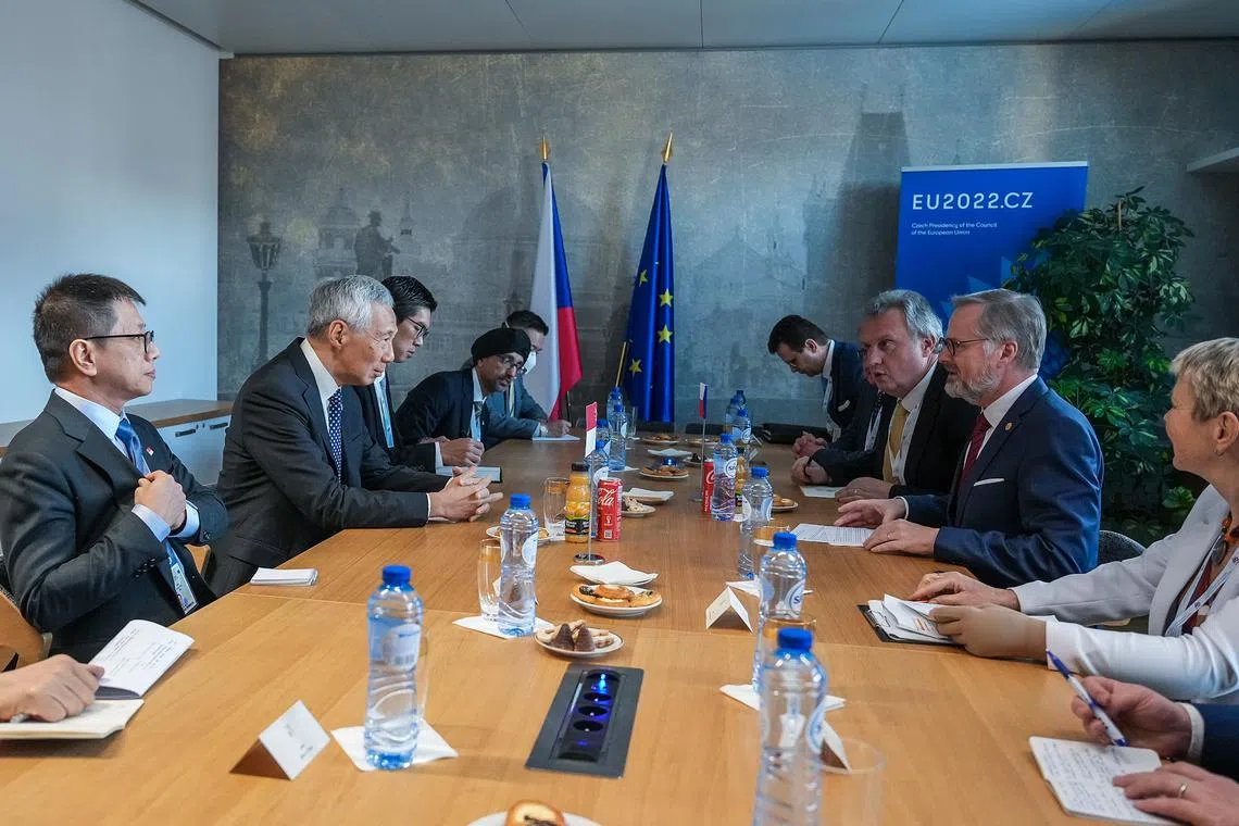 Prime Minister Lee Hsien Loong (second from left) meets Czech Republic Prime Minister Petr Fiala (second from right) during their bilateral meeting at the Asean-EU summit in Brussels, on Dec 14, 2022.