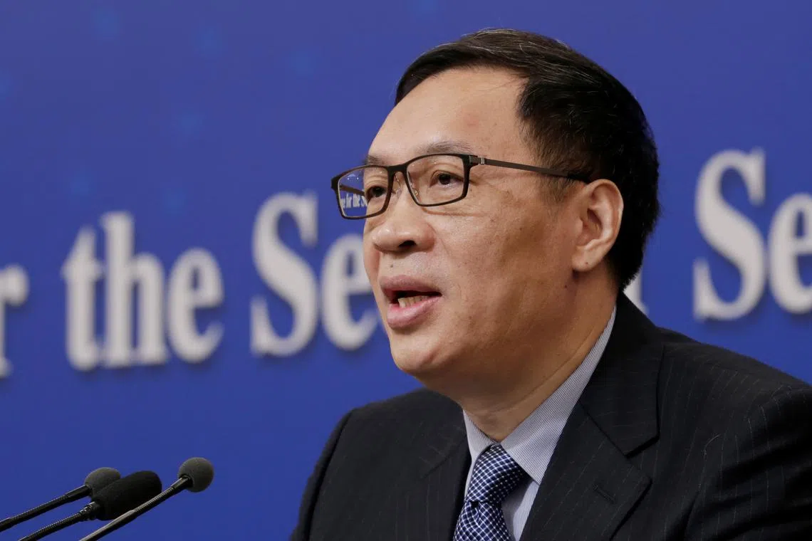 FILE PHOTO: Fan Yifei, vice governor of the People's Bank of China (PBOC), attends a news conference during the ongoing session of the National People's Congress (NPC) in Beijing, China March 10, 2019. REUTERS/Jason Lee/File Photo