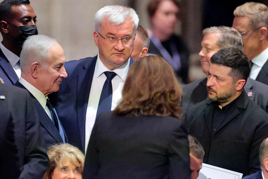 (From left) Israeli Prime Minister Benjamin Netanyahu, Ukrainian Foreign Minister Andrii Sybiha and Ukrainian President Volodymyr Zelensky meeting at a funeral service for late US Senator Lindsey Graham in Washington, on July 28.
