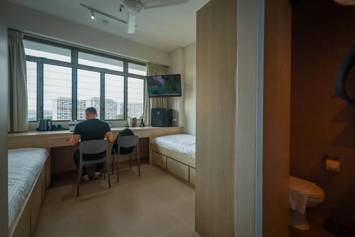 A co-living unit with two single-sized bed at Coliwoo Boon Lay.