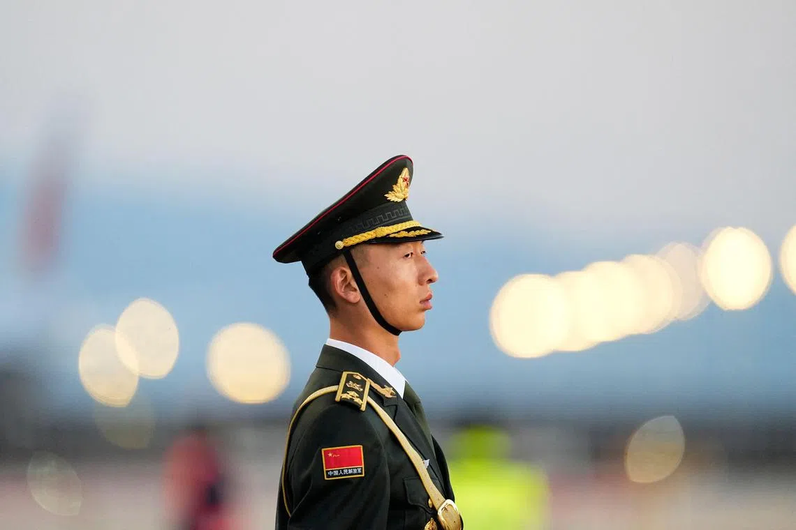 A guard honor stands at Beijing Capital International Airport, prior to the arrival of Ethiopian Prime Minister Abiy Ahmed, as he attends the Third Belt and Road Forum in Beijing, China, October 16, 2023. (Photo by Ken Ishii / POOL / AFP)