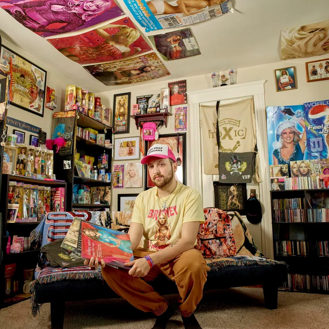Mr Zachary Gordon-Abraham surrounded by Britney Spears memorabilia at home in north-eastern Pennsylvania.