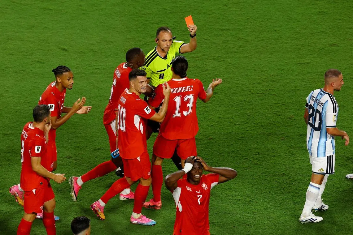 Switzerland’s Breel Embolo is shown a red card by referee Joao Pinheiro after a VAR review during the 2026 World Cup quarter final match against Argentina.