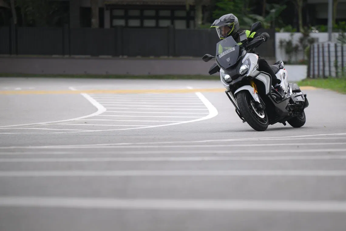 The Straits Times senior correspondent Zaihan Mohamed Yusof riding a Peugeot XP400 GT on June 11, 2025.