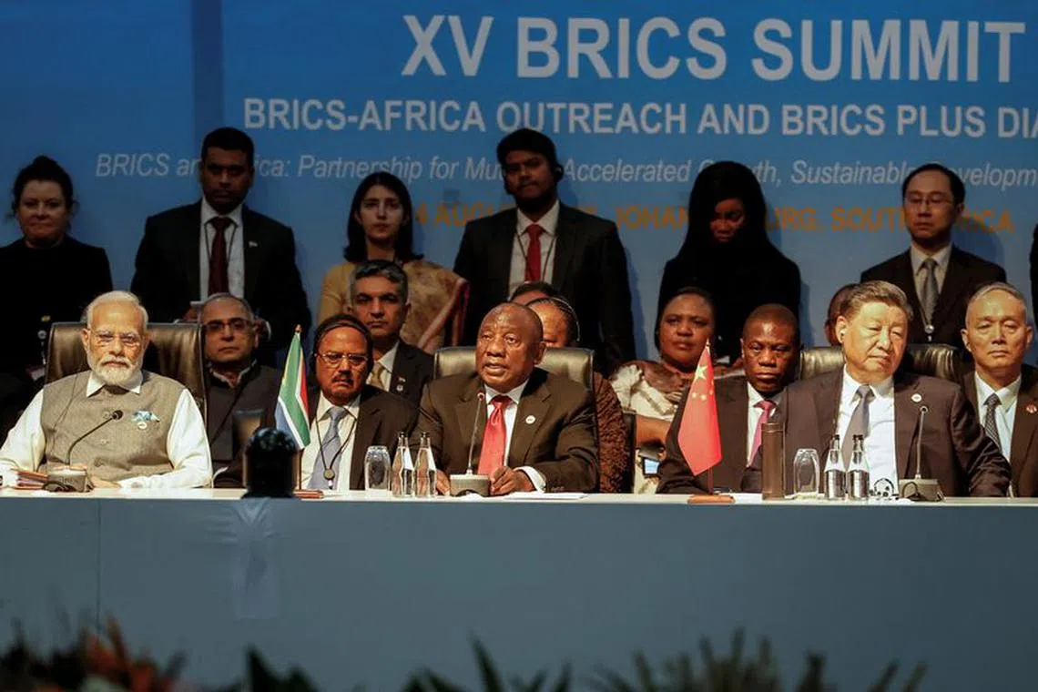 Prime Minister of India Narendra Modi, South African President Cyril Ramaphosa and President of China Xi Jinping attend a meeting during the 2023 BRICS Summit at the Sandton Convention Centre in Johannesburg on August 24, 2023. Marco Longari/Pool via REUTERS