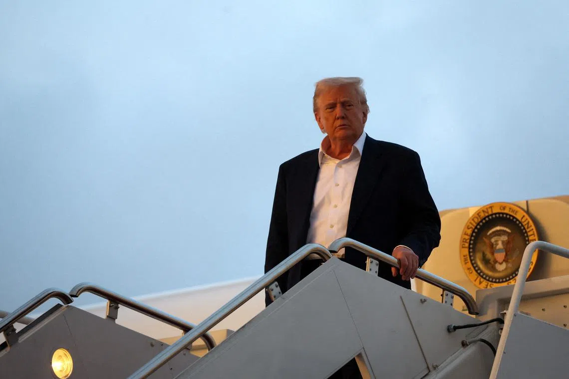 FILE PHOTO: U.S. President Donald Trump exits Air Force One upon arriving at Joint Base Andrews, while on his way back to the White House after a weekend in West Palm Beach, Florida, at Joint Base Andrews in Maryland, U.S., May 4, 2025. REUTERS/Leah Millis/File Photo