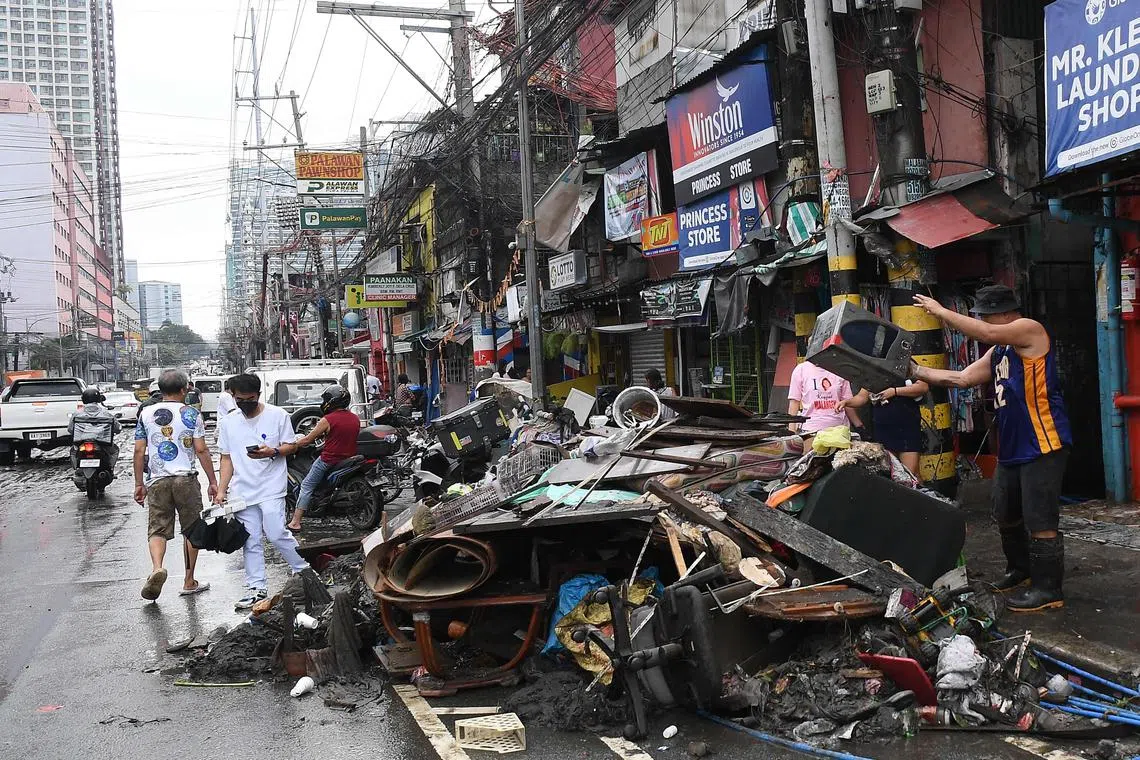 Debris and damaged buildings are seen a day after heavy rains from Typhoon Gaemi hit Manila, on July 25.