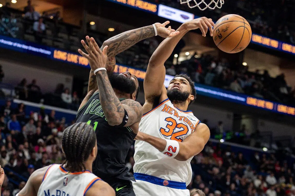 New York Knicks center/forward Karl-Anthony Towns knocks the ball loose from New Orleans Pelicans guard/forward Saddiq Bey during the second half at Smoothie King Center.