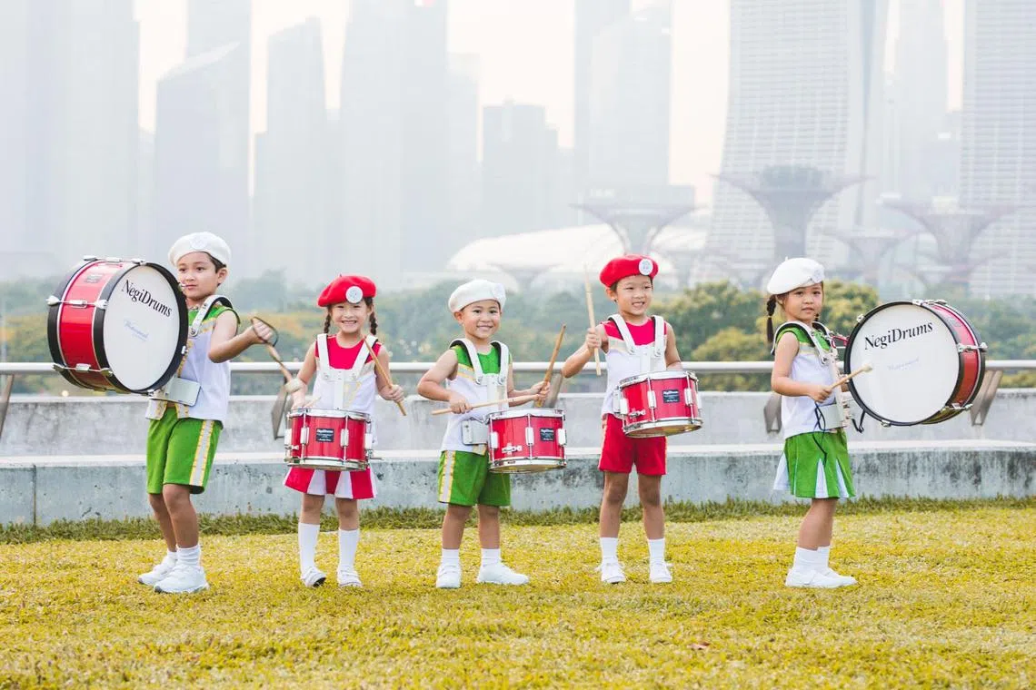 The marching band and stage ensemble regularly perform in public, providing Kinderland children with opportunities to build self-confidence and showcase their talents.