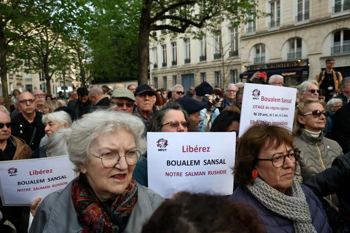 FILE PHOTO: People attend a gathering in support of detained Franco-Algerian writer Boualem Sansal in Paris, France, March 25, 2025. REUTERS/Sarah Meyssonnier/File Photo
