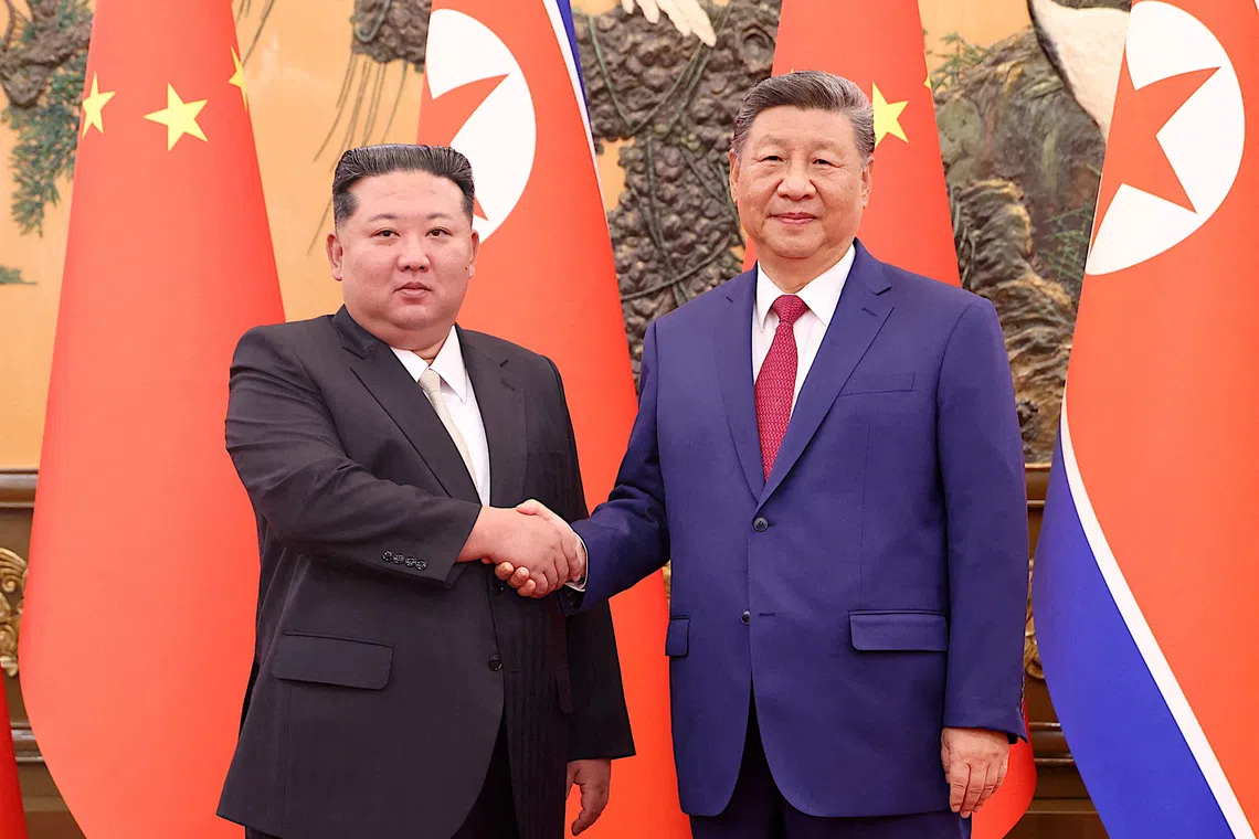 FILE PHOTO: Chinese President Xi Jinping and Democratic People's Republic of Korea (DPRK) leader Kim Jong Un shake hands at the Great Hall of the People in Beijing, China September 4, 2025. China Daily via REUTERS/File Photo