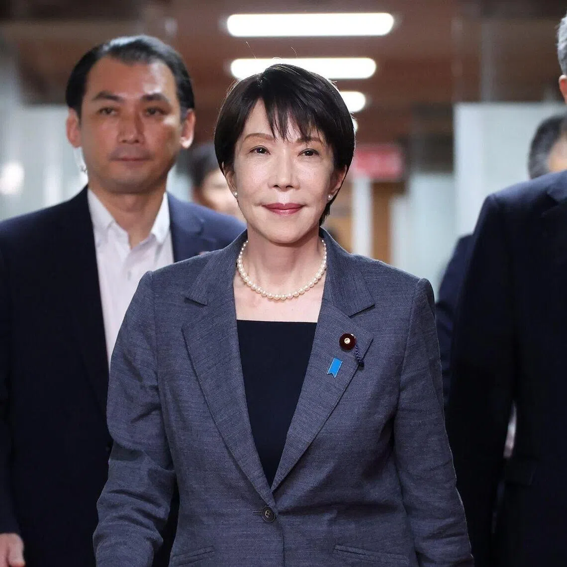 Japan’s Prime Minister Sanae Takaichi (centre) departs following a meeting with the Liberal Democratic Party executives at the party’s headquarters in Tokyo.