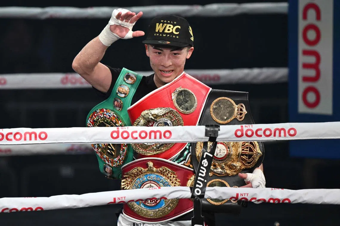 Japan's WBC and WBO super bantamweight champion Naoya Inoue celebrating his victory over the Philippines' WBA and IBF super bantamweight champion Marlon Tapales after their four-belt world super bantamweight title unification match at Tokyo's Ariake Arena on Dec 26.