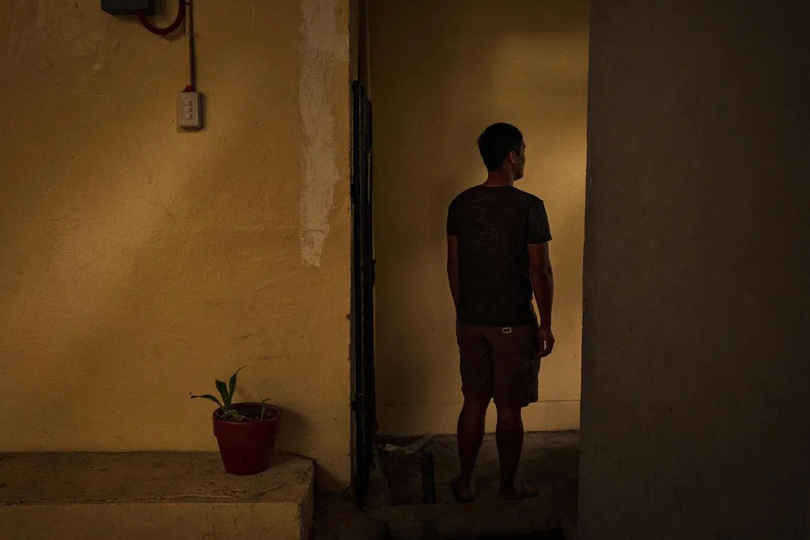 Nathan in Manila on June 26, 2023. A Filipino national, Nathan was promised a job in customer service in Thailand. Instead, he found himself in Cambodia, being ordered to defraud strangers online and beaten for refusing. He managed to return to the Philippines but still fears retribution.  (Ezra Acayan/The New York Times)

