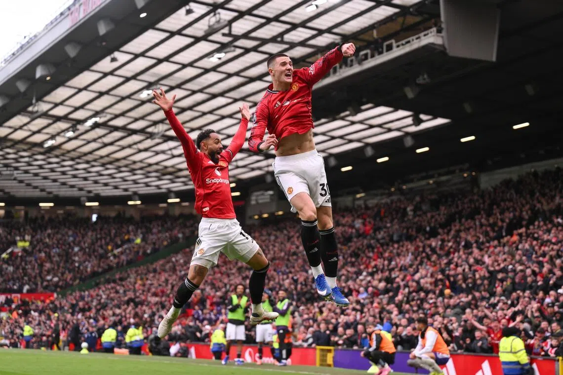 Benjamin Sesko (right) of Manchester United celebrates scoring the third goal of their 3-1 English Premier League win over Aston Villa with Bruno Fernandes on March 15.