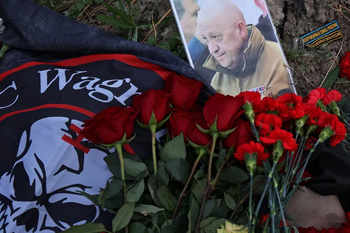 A portrait of Wagner mercenary chief Yevgeny Prigozhin at a makeshift memorial near former PMC Wagner Centre in Saint Petersburg, Russia on Aug 24, 2023.