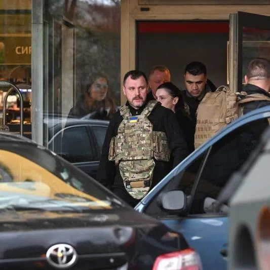Ukraine's Minister of Internal Affairs Igor Klimenko leaving a supermarket following a shooting in Kyiv on April 18, 2026.