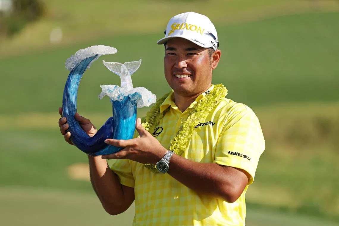 Hideki Matsuyama of Japan poses with the trophy after winning The Sentry 2025 at Kapalua Golf Club.