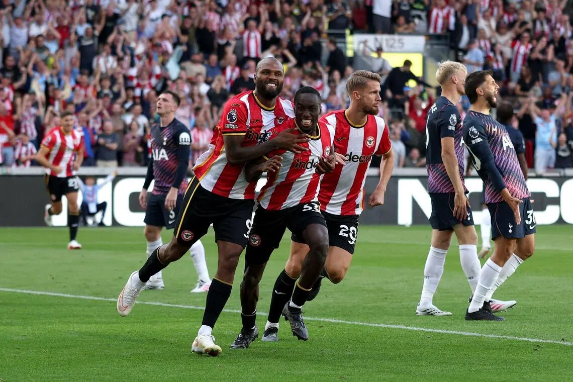 Brentford’s Michael Kayode (centre) celebrates with teammate Igor Thiago (left) after scoring the team’s third goal against Tottenham Hotspur.