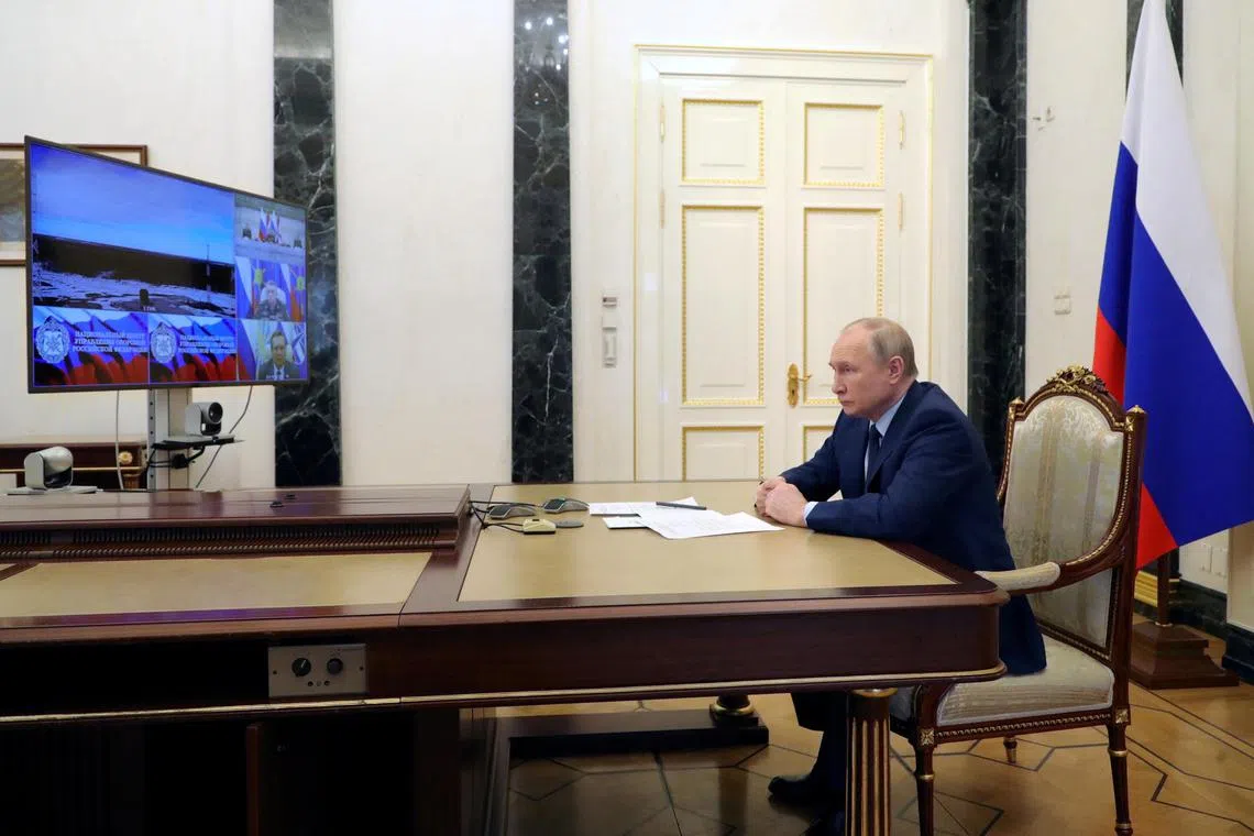 Russian President Vladimir Putin is seen watching a test launch of the Sarmat intercontinental ballistic missile in April 2022. 