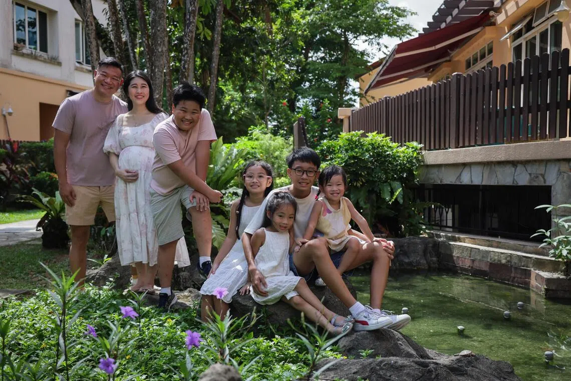 (From left) Teacher Clement Chua and freelance writer Kelly Ang, who is expecting yheir sixth child, with their children Tobias, Isabella, Lily Beth, Gabriel and Christabel.
