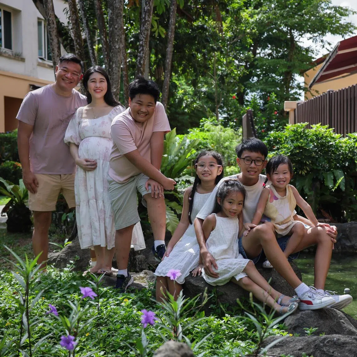 (From left) Teacher Clement Chua and freelance writer Kelly Ang, who is expecting yheir sixth child, with their children Tobias, Isabella, Lily Beth, Gabriel and Christabel.