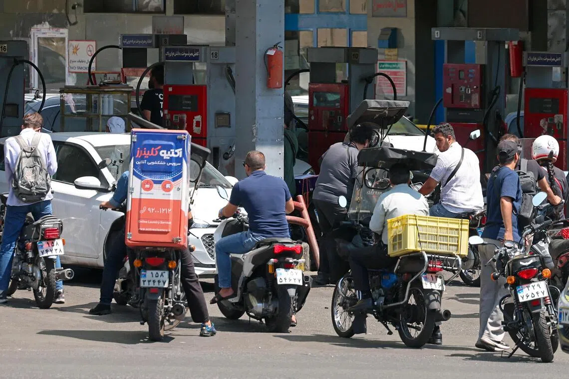Drivers queuing at a petrol station in Tehran on Aug 25. Iran faces difficulty importing enough fuel to meet demand due to a US naval blockade.