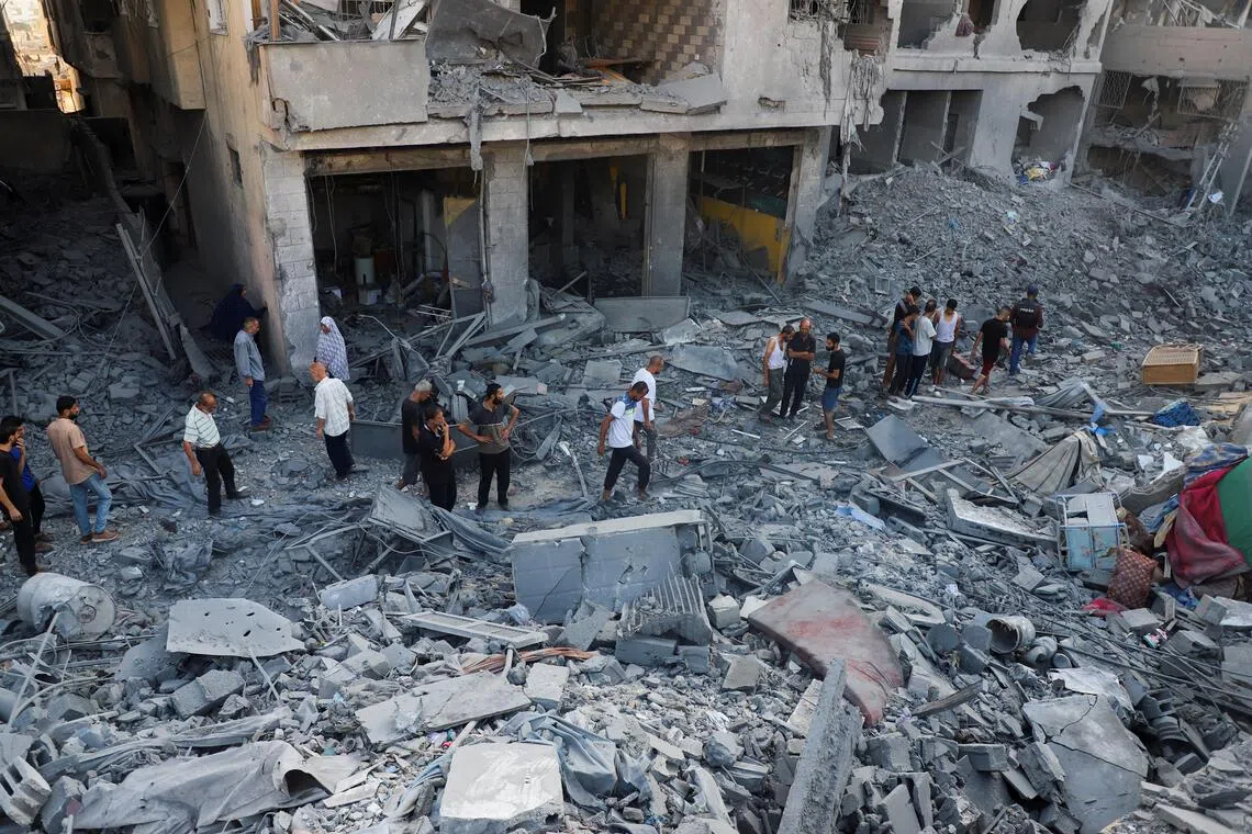 Palestinians inspecting the rubble of a house in Gaza City after an overnight strike by Israel on Sept 16.