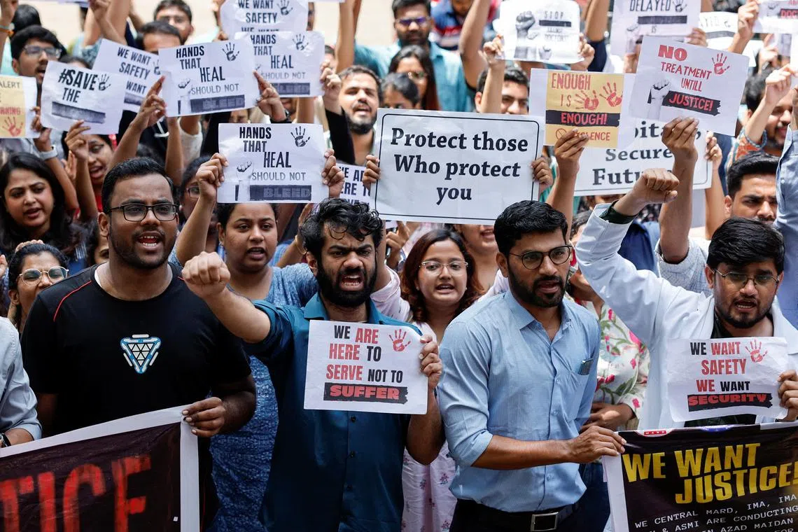 Medical staff shout slogans while holding placards during a protest at a hospital in Mumbai, after a nationwide strike was declared by the Indian Medical Association to protest the rape and murder of a trainee medic at a government-run hospital in Kolkata, India, August 17, 2024. REUTERS/Francis Mascarenhas