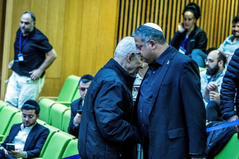 Israeli Prime Minister Benjamin Netanyahu and Israel’s far-right National Security Minister Itamar Ben-Gvir shake hands as they attend a session at the Knesset, Israeli Parliament, in Jerusalem.