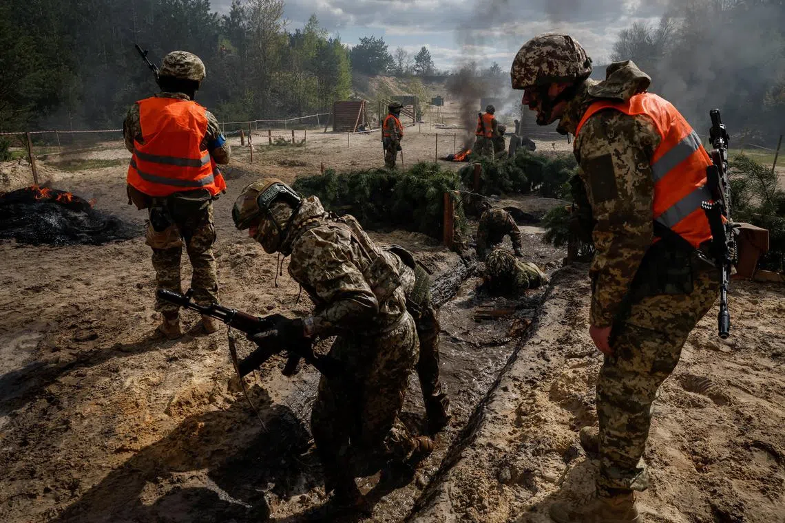 Ukrainian servicemen attend an exercise near the border with Belarus, in April 2023. 