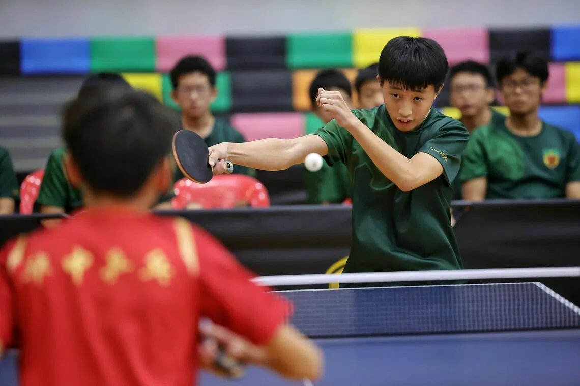 Neo Cheng Ming of Raffles Institution in action against Ian Lei of Hwa Chong Institution during the boys’ C division table tennis final at Pasir Ris Sports Hall on Aug 6.