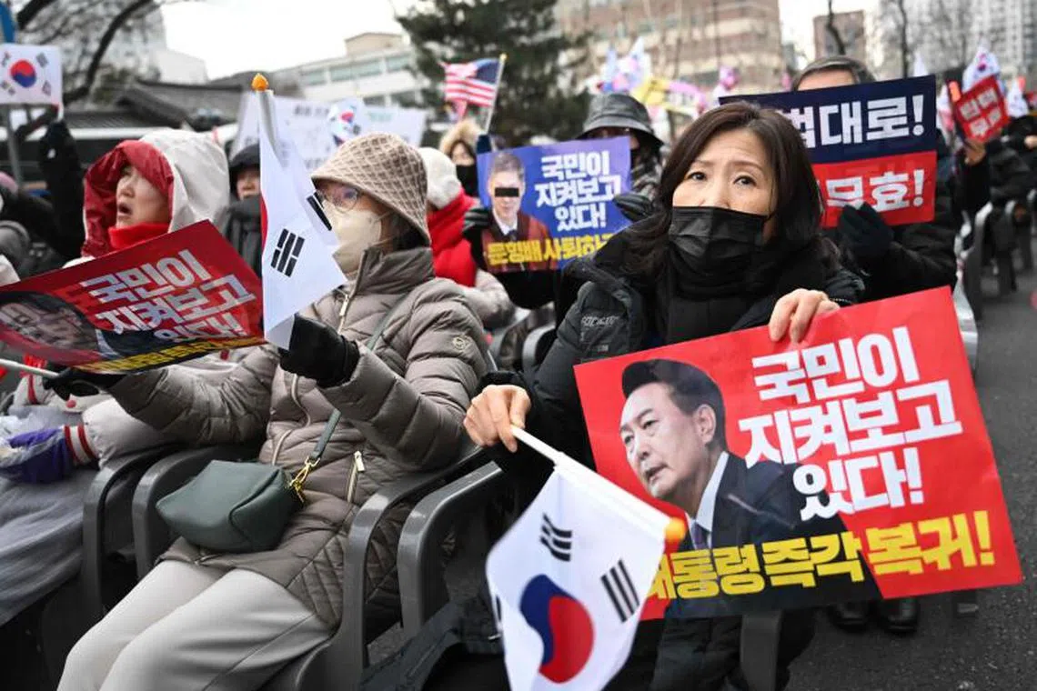 Supporters of South Korea President Yoon Suk Yeol hold a rally near the Constitutional Court in Seoul.