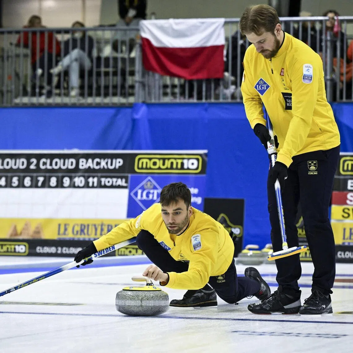 Sweden's Christoffer Sundgren, Oskar Eriksson and Rasmus Wranaa in action during the men's gold medal match at the  Le Gruyere AOP European Curling Championships in Lohja, Finland, on Nov 29, 2025.