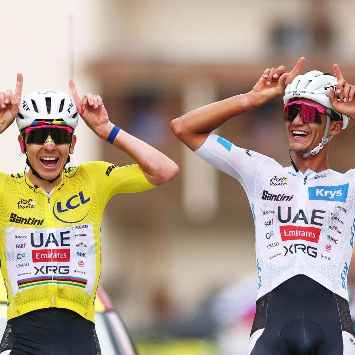 Cycling - Tour de France - Stage 20 - Le Bourg d'Oisans to Alpe d'Huez - Alpe d'Huez, France - July 25, 2026
UAE Team Emirates XRG's Tadej Pogacar wearing the yellow jersey and UAE Team Emirates XRG's Isaac Del Toro wearing the white jersey react at the end of stage 20 REUTERS/Gonzalo Fuentes