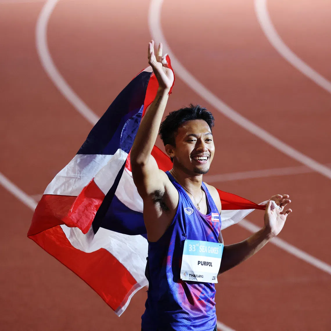 Southeast Asian Games - SEA - Athletics - Suphachalasai National Stadium, Bangkok, Thailand - December 13, 2025 Thailand's Puripol Boonson celebrates after winning the men's 200m final REUTERS/Patipat Janthong