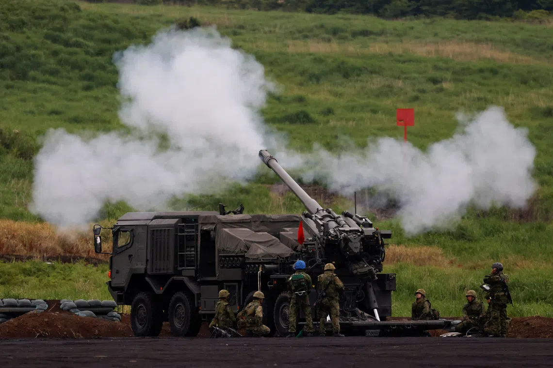 Japan casts military buildup as path to economic prosperity