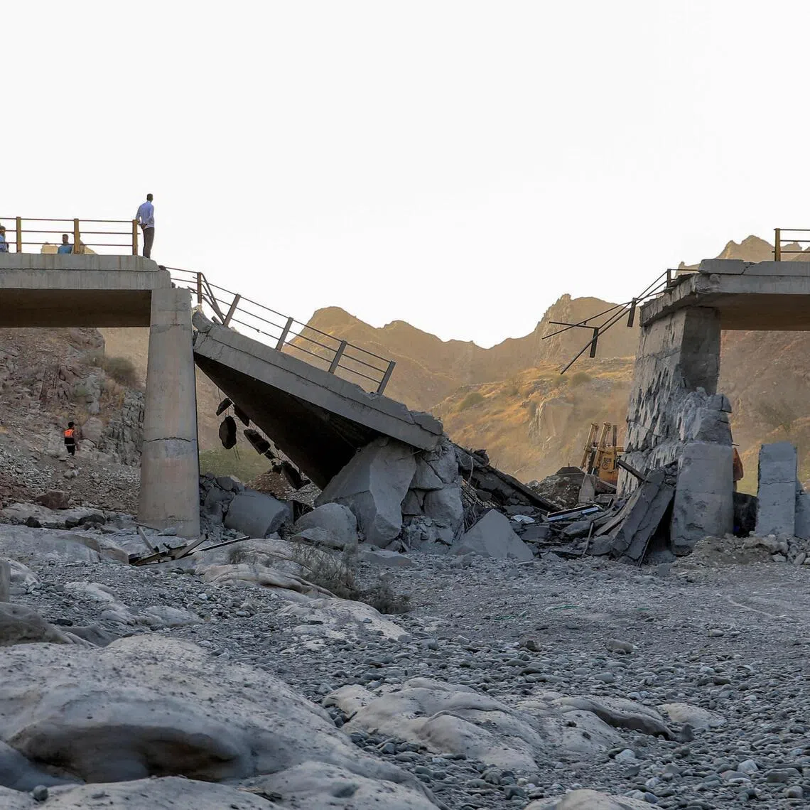 A heavily-damaged bridge which was hit by a US strike connecting Roudan and Bandar Abbas in southern Iran on July 18.
