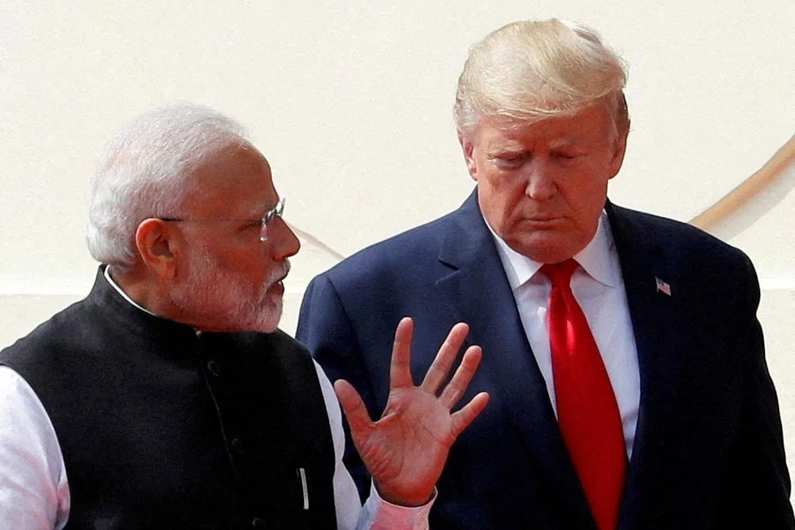 FILE PHOTO: U.S. President Donald Trump and India's Prime Minister Narendra Modi talk as they arrive for a joint news conference after bilateral talks at Hyderabad House in New Delhi, India, February 25, 2020. REUTERS/Al Drago/File Photo