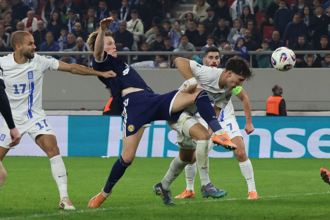 Soccer Football - FIFA World Cup - UEFA Qualifiers - Group C - Greece v Scotland - Karaiskakis Stadium, Piraeus, Greece - November 15, 2025 Scotland's Scott McTominay in action with Greece's Panagiotis Retsos REUTERS/Louiza Vradi
