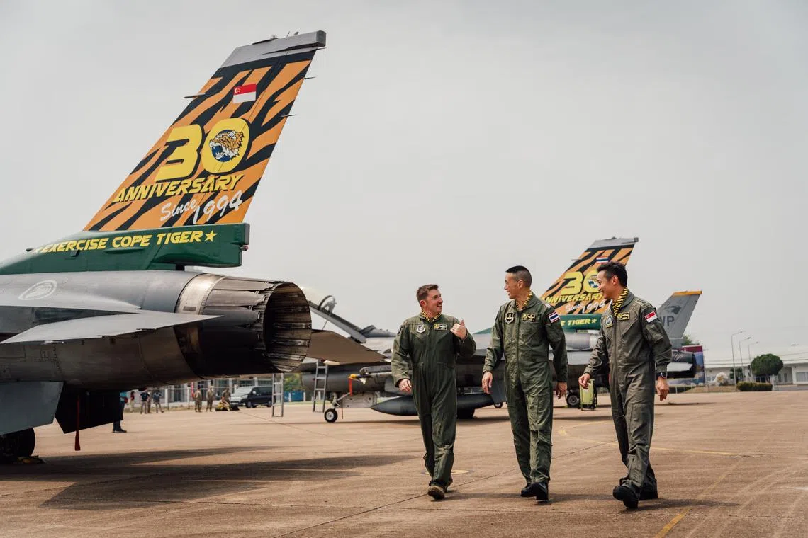 Exercise Directors (from left) COL Jeffrey Shulman, USAF, Group Captain Aron Charusombat, RTAF, and COL Sebastian Chai at Korat Air Base, Thailand.