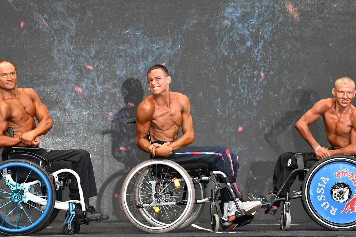 Male bodybuilders in wheelchairs taking part in the 2023 World Cup of Bodybuilding & Fitness and 2023 World Fitness Challenge Championship in Bishkek on October 28, 2023. 