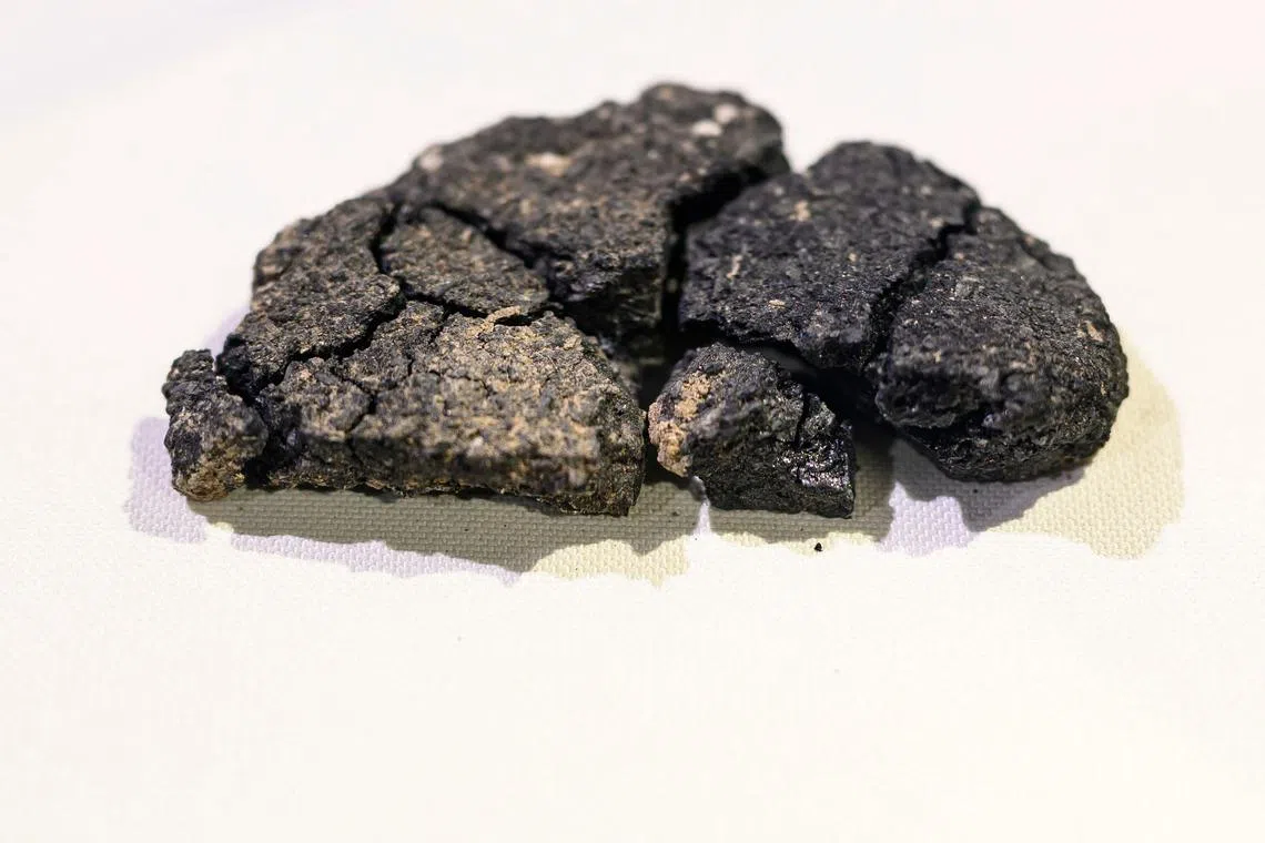 Unearthed more than 5,000 years later, a slice of charred bread is on display at the Eskisehir Archaeological Museum.