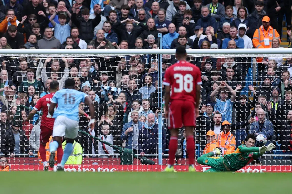 Soccer Football - FA Cup - Quarter Final - Manchester City v Liverpool - Etihad Stadium, Manchester, Britain - April 4, 2026 Manchester City's James Trafford saves a penalty taken by Liverpool's Mohamed Salah REUTERS/Phil Noble
