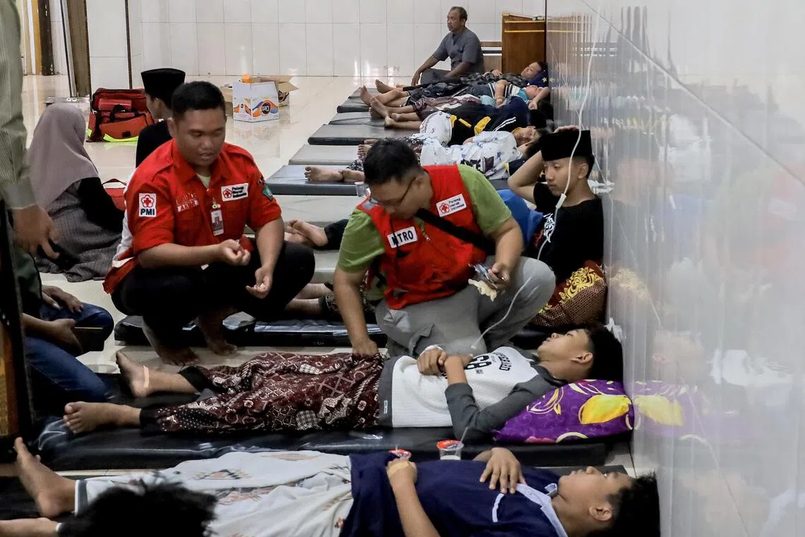 Indonesia’s top rights body calls for police to probe food poisoning of about 2,000 students